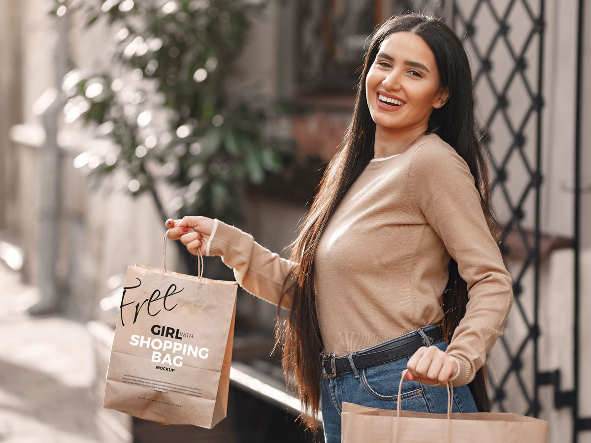 Girl-With-Shopping-Bag-MockUp-Freebie-on-Antique-Wooden-Background