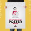 Free-Young-Man-Holding-Poster-Mockup-600