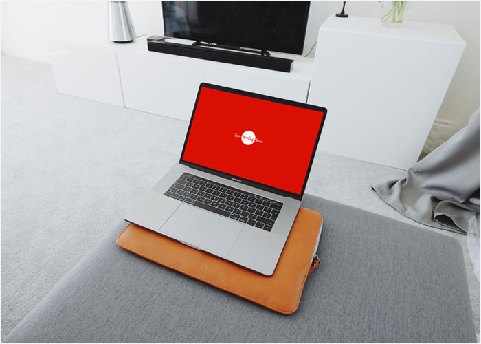 Free-MacBook-Pro-in-Living-Room-Mockup-2018