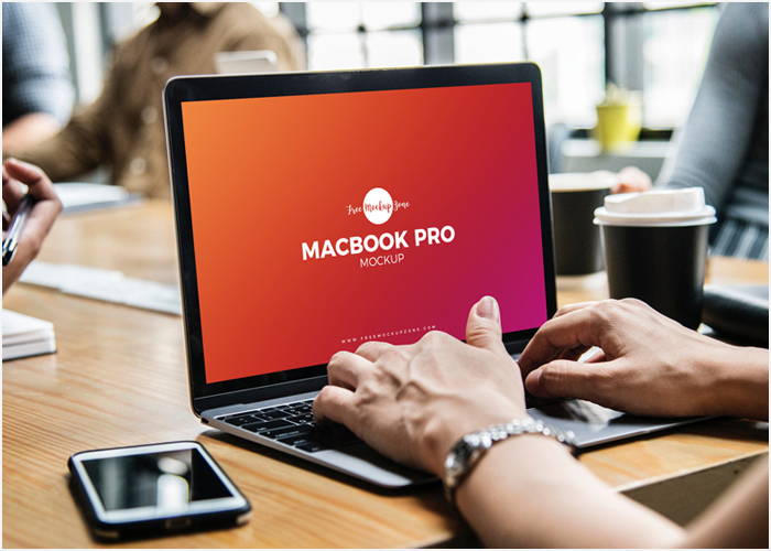 Free-Person-Using-Macbook-Pro-Mockup-Psd