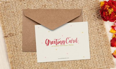 Free-Greeting-Card-on-Sackcloth-With-Flowers-Mockup-600
