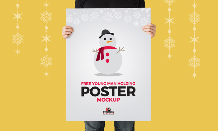 Free-Young-Man-Holding-Poster-Mockup-600